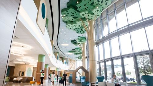 Chief Administrative Officer of Children’s Healthcare of Atlanta Linda Matzigkeit (second from left) walks through the lobby of the new Arthur M. Blank Pediatric Hospital in Atlanta on Tuesday, August 6, 2024. The 19-story, 2 million-square-foot facility, expected to be one of the most advanced pediatric hospitals in the country, will open on September 29, 2024. CHRISTINA MATACOTTA FOR THE ATLANTA JOURNAL-CONSTITUTION