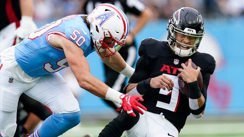 Atlanta Falcons quarterback Desmond Ridder (9) is hit by Tennessee Titans linebacker Jack Gibbens (50) during the first half of an NFL football game, Sunday, Oct. 29, 2023, in Nashville, Tenn. (AP Photo/George Walker IV)