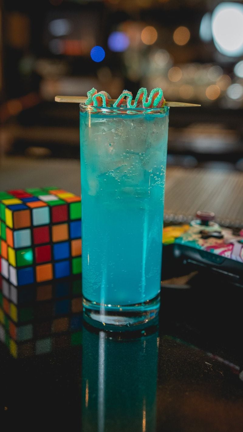 This zero-proof cocktail at Battle & Brew is sweet, citrusy and is served with a rainbow sour candy garnish. (Courtesy of Battle & Brew)