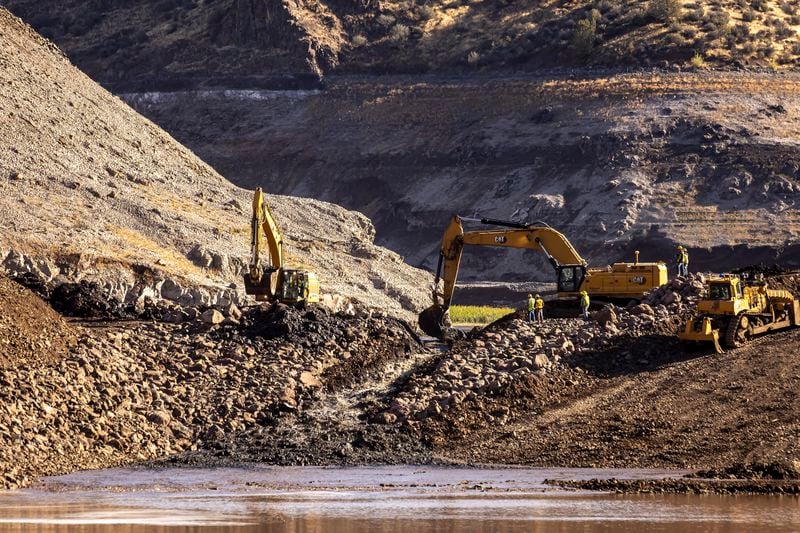 FILE - Construction crews remove the top of the cofferdam that was left of Iron Gate Dam allowing the Klamath River to run in its original path near Hornbrook, Calif., Aug. 28, 2024. (Carlos Avila Gonzalez/San Francisco Chronicle via AP, File)