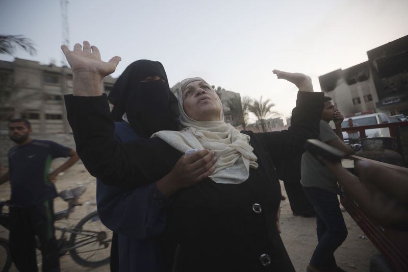 Palestinian women mourn loved ones killed by Israeli bombardment, during their funeral in Khan Younis, southern Gaza Strip, Friday, June 21, 2024. (AP Photo /Jehad Alshrafi)