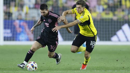 Inter Miami's Lionel Messi, left, and Columbus Crew's Malte Amundsen chase the ball during the second half of an MLS soccer match, Wednesday, Oct. 2, 2024, in Columbus, Ohio. (AP Photo/Jay LaPrete)