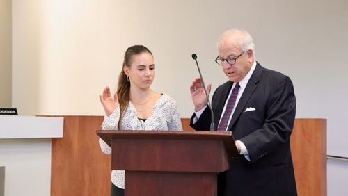 Decatur High senior Sophie D'Elena was sworn onto the City Schools of Decatur's board of education by board attorney Bob Wilson. Courtesy