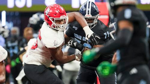 Savannah Christian defensive lineman Elijah Griffin (95) goes against a Cedar Grove offensive lineman during the Class 3A GHSA State Championship game at Mercedes-Benz Stadium, Wednesday, December. 13, 2023, in Atlanta. (Jason Getz / Jason.Getz@ajc.com)