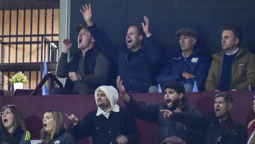 Britain's Prince William, second left in back row, reacts during the Champions League opening phase soccer match between Aston Villa and Bayern Munich, at Villa Park in Birmingham, England, Wednesday, Oct. 2, 2024. (AP Photo/Rui Vieira)