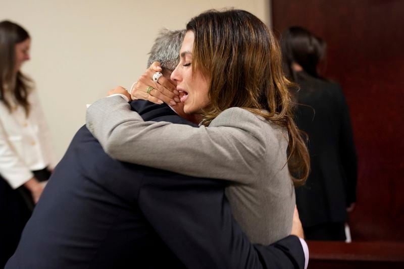 Actor Alec Baldwin, left, and his wife Hilaria embrace after a judge threw out the involuntary manslaughter case for the 2021 fatal shooting of cinematographer Halyna Hutchins during filming of the Western movie "Rust," Friday, July 12, 2024, in Santa Fe, N.M. (Ramsay de Give/Pool Photo via AP)