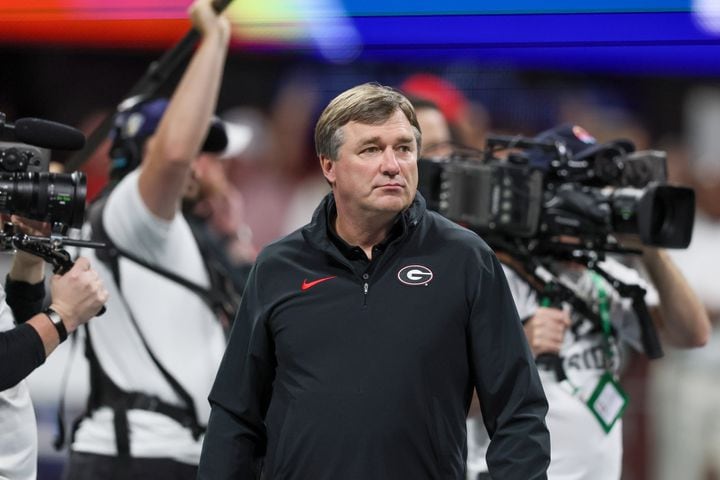 Georgia Bulldogs head coach Kirby Smart surveys warmups before facing the Alabama Crimson Tide during the SEC Championship football game at the Mercedes-Benz Stadium in Atlanta, on Saturday, December 2, 2023. (Jason Getz / Jason.Getz@ajc.com)