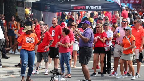 Georgia and Clemson fans fill the streets outside Bank of America Stadium as the teams prepare to play in a NCAA college football game on Saturday, Sept 4, 2021, in Charlotte.    “Curtis Compton / Curtis.Compton@ajc.com”