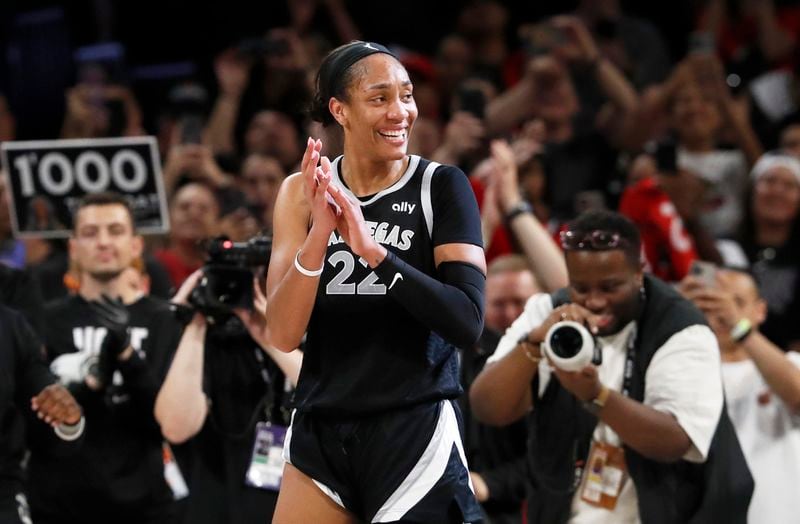 Las Vegas Aces center A'ja Wilson (22) celebrates during the second half of a WNBA basketball game against the Connecticut Sun, Sunday, Sept. 15, 2024, in Las Vegas. (Steve Marcus/Las Vegas Sun via AP)