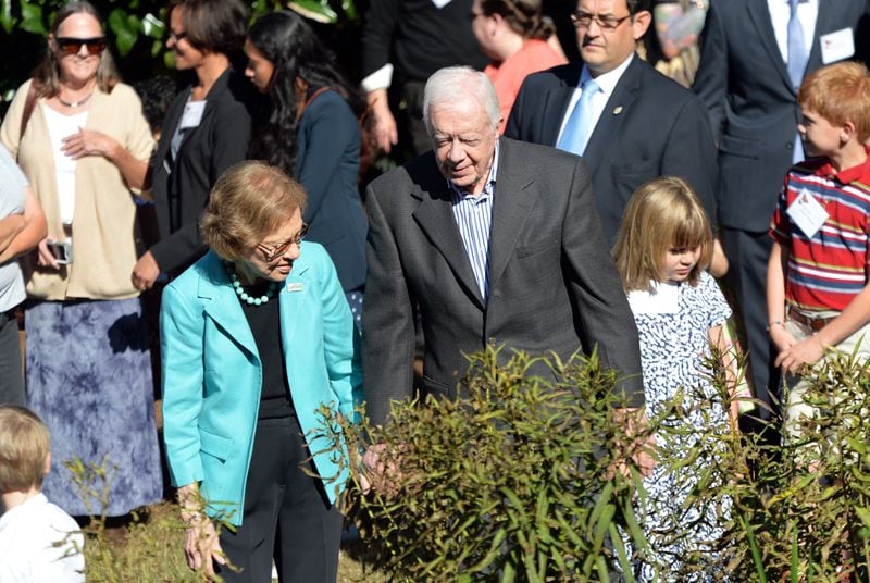 Former President Jimmy Carter and former first lady Rosalynn Carter tour at The Jimmy and Rosalynn Carter Pollinator Garden at The Carter Center in honor of his 90th birthday on Wednesday, October 1, 2014. The garden is certified by Monarch Watch as an official monarch way station, and is listed as a certified wildlife habitat of the National Wildlife Federation. The garden features milkweed, the host plant monarch butterflies need to complete their life cycle, and a variety of plants that can host Georgia's state butterfly, the tiger swallowtail. HYOSUB SHIN / HSHIN@AJC.COM