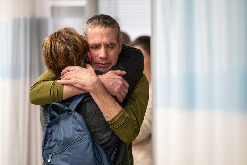 FILE - Freed hostage Fernando Simon Marman, right, hugs a relative after being rescued from captivity in the Gaza Strip, at the Sheba Medical Center in Ramat Gan, Israel, Feb. 12, 2024. (Israeli Army via AP, File)