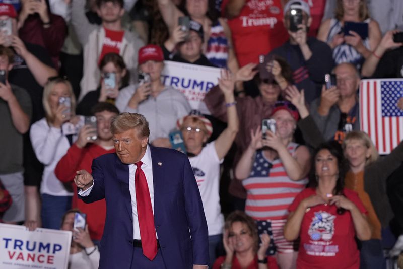 Republican presidential nominee former President Donald Trump arrives at a campaign event at the Ryder Center at Saginaw Valley State University, Thursday, October. 2, 2024 in University Center, Mich. (AP Photo/Carlos Osorio)