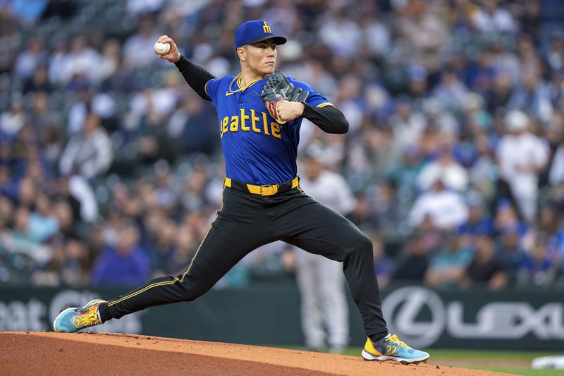 Seattle Mariners starter Bryan Woo delivers a pitch during the first inning of a baseball game against the New York Yankees, Tuesday, Sept. 17, 2024, in Seattle. (AP Photo/Stephen Brashear)