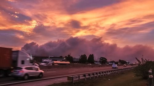 A large plume caused by a chemical reaction was still visible over the BioLab facility in Conyers, where a fire broke out Sunday.