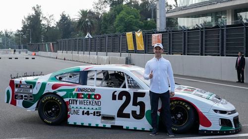 NASCAR driver Daniel Suarez, of Mexico, poses for a photo on the Autódromo Hermanos Rodríguez track in Mexico City, Tuesday, Aug. 27, 2024. (AP Photo/Eduardo Verdugo)