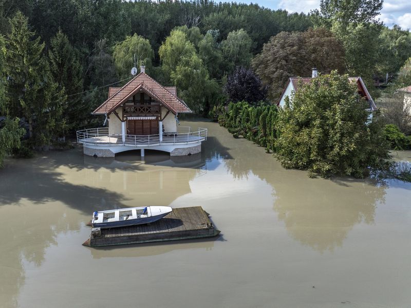 An aerial picture taken with a drone shows the flooded resort village of Venek and the swollen Danube River near Gyor, Hungary, Tuesday, September 17, 2024. (Gergely Janossy/MTI via AP)