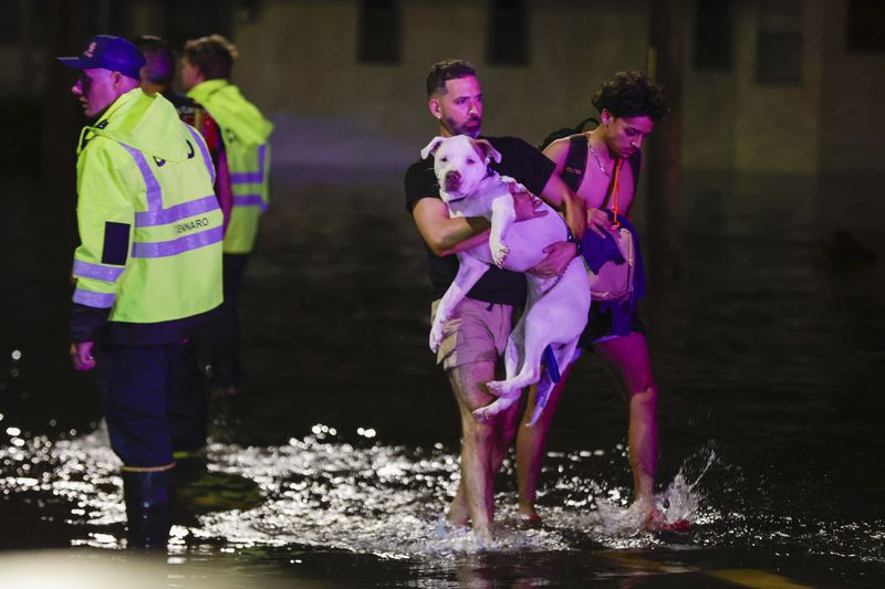 FILE - Residents are rescued from floodwaters in the aftermath of Hurricane Helene, Sept. 27, 2024 in Crystal River, Fla. (Luis Santana/Tampa Bay Times via AP, File)