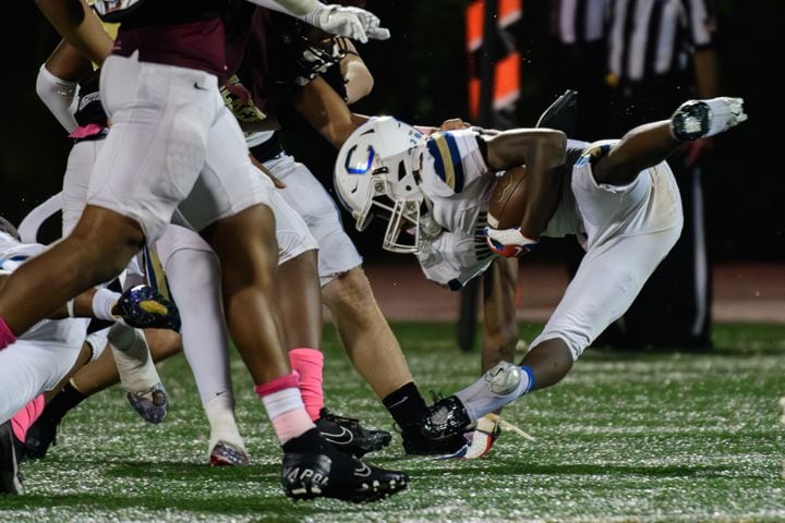 Chamblee's Larry Harris gets tackled during their game against Tucker, October 6, 2023. (Jamie Spaar for the Atlanta Journal Constitution)