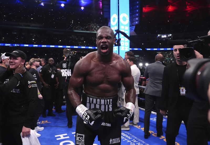 Daniel Dubois celebrates victory against Anthony Joshua, not pictured, in the IBF World Heavyweight bout at Wembley Stadium, in London, Saturday, Sept. 21, 2024. (Bradley Collyer/PA via AP)