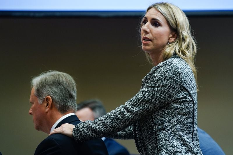 Defense attorney Amanda Clark Palmer holds the shoulders of Robert "Chip" Olsen while giving her closing argument during day five of Olsen's murder trial at the DeKalb County Courthouse on October 3, 2019 in Decatur. Olsen is charged with murdering war veteran Anthony Hill. (Elijah Nouvelage for The Atlanta Journal-Constitution)