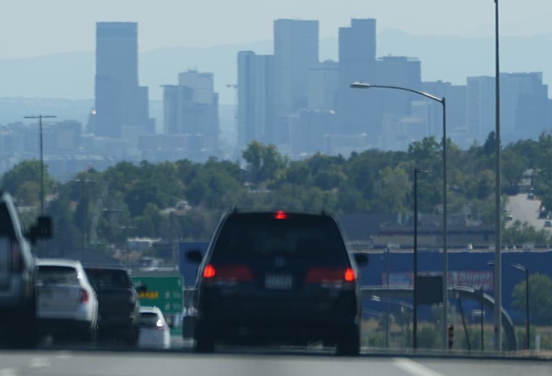 The skyline of downtown is obscured by smoke carried into the Rocky Mountain region from wildfires near Los Angeles, Thursday, Sept. 12, 2024, in Denver. (AP Photo/David Zalubowski)