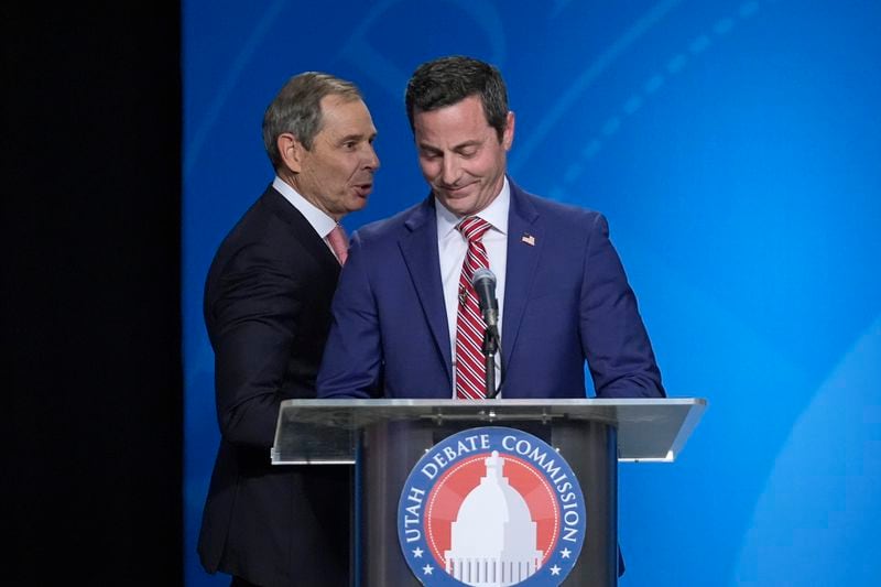 FILE - U.S. Rep. John Curtis, left, reacts to a statement made by Trent Staggs, right, following the Utah Senate primary debate for Republican contenders battling to win the seat of retiring U.S. Sen. Mitt Romney on June 10, 2024, in Salt Lake City. Curtis, who is considered the front-runner, has pitched himself as the alternative to Trump-backed Riverton Mayor Staggs and two other contenders, who have spent much of the race arguing over whose policy positions most closely align with Trump's. (AP Photo/Rick Bowmer, Pool, File)