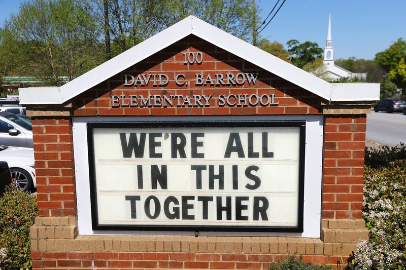 Local schools and churches are on shutdown but the sign at David C. Barrow Elementary School in Athens posts what is fast becoming a national motto. Curtis Compton/ccompton@ajc.com