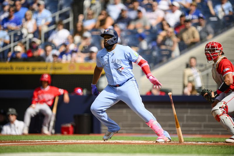 Toronto Blue Jays' Vladimir Guerrero Jr. hits an RBI double during the first inning of a baseball game against the Los Angeles Angels in Toronto, Saturday, Aug. 24, 2024. (Christopher Katsarov/The Canadian Press via AP)