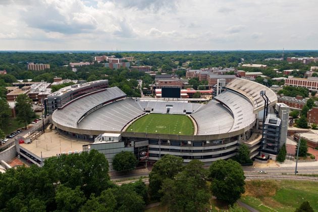 June 11, 2021 Athens - Aerial photo shows Sanford Stadium at the University of Georgia in Athens on Friday, June 11, 2021. With a $25 million expansion completed in 2003 and another $8 million in 2004, Sanford Stadium added a second upper deck on the north side and 27 new north side SkySuites bringing the new stadium capacity to 92,746Ñthe fifth largest on-campus stadium in the country. UGAÕs athletic department simply is committed to too many other facility projects that have precedence at the moment. Most notable is the $80 million football operations building that has been added to the Butts-Mehre complex. (Hyosub Shin / Hyosub.Shin@ajc.com)