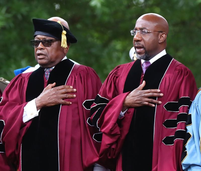 U.S. Rep. James E. Clyburn, D-S.C., (left), received the Honorary Doctor of Laws degree, and U.S. Sen. Raphael Warnock, D-Ga., (right), received the Honorary Doctor of Humane Letters degree at Morehouse College's 2022 commencement ceremony. Warnock, a Morehouse graduate, also delivered the commencement address. AJC FILE PHOTO.