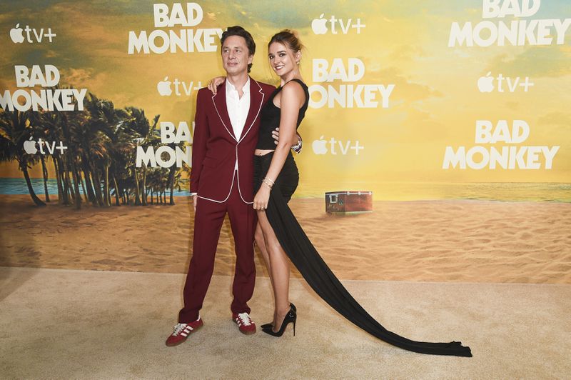 Zach Braff, left, and Charlotte Lawrence arrive at the premiere of "Bad Monkey" on Monday, Aug. 12, 2024, in Los Angeles. (Photo by Richard Shotwell/Invision/AP)