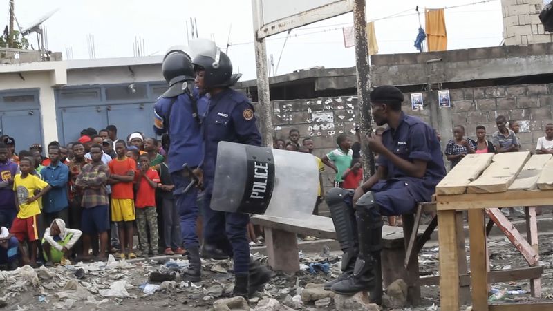 This image made from video shows police officers outside Makala prison in Kinshasa, Democratic Republic of the Congo, following an attempted jailbreak in Congo's main prison Monday Sept. 2, 2024. (AP Photo)