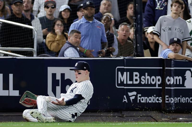 New York Yankees outfielder Alex Verdugo (24) comes up with the catch on a fly ball hit by Kansas City Royals' Michael Massey to end the fourth inning during Game 1 of the American League baseball division series, Saturday, Oct. 5, 2024, in New York. (AP Photo/Adam Hunger)