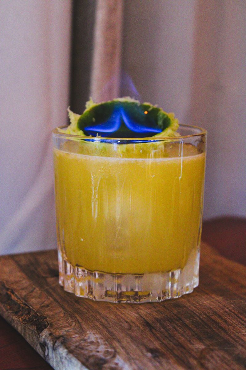 Wahoo Grill's eternal torch cocktail is set alight with overproof cognac. (Courtesy of Wahoo Grill)