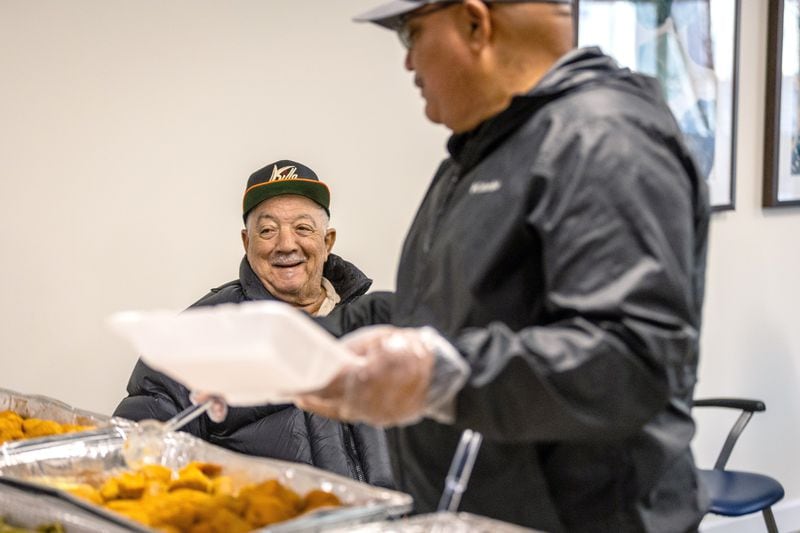 Volunteers make up a Thanksgiving day meal for residents at the James Allen, Jr. Place apartments  Thursday, Nov. 23, 2023.   (Steve Schaefer/steve.schaefer@ajc.com)