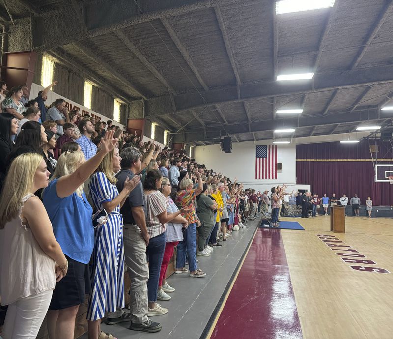 Students, teachers and community members pack the Morgan Academy gym to honor Caden Tellier, the football player and high school student who died from an injury in a game Friday night. The memorial service opened with one of Caden's favorite songs in Selma, Ala., Monday, Aug. 26, 2024. (AP Photo/Safiyah Riddle)