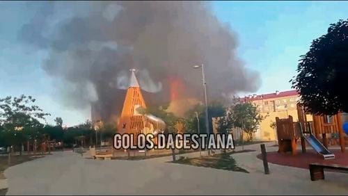 This photo taken from video released by Golos Dagestana shows smoke rises following an attack in Makhachkala, republic of Dagestan, Russia, Sunday, June 23, 2024. Russian state news agency RIA Novosti says that armed militants attacked two Orthodox churches, a synagogue and a traffic police post in Russia's southern republic of Dagestan, killing a priest and six police officers. (Golos Dagestana via AP)