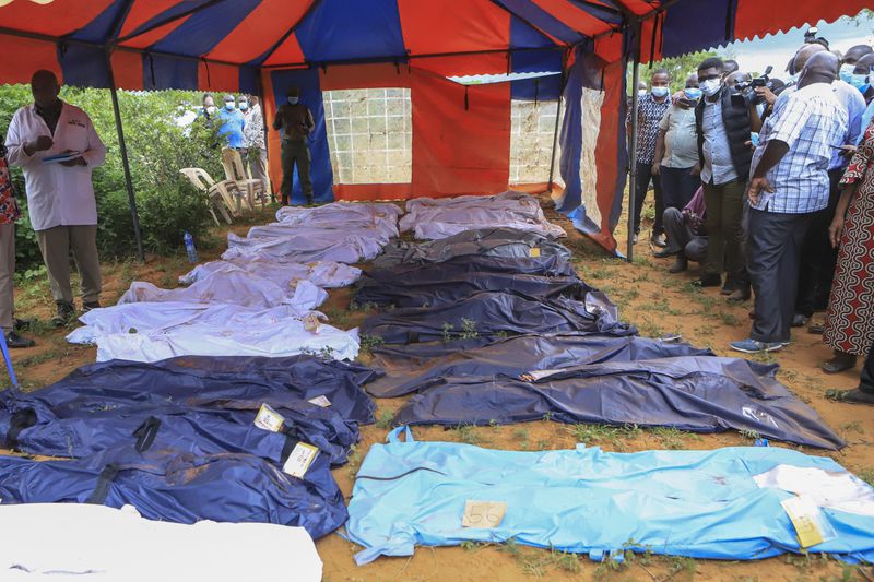 FILE - Body bags are laid out at the scene where dozens of bodies, believed to be followers of extremist evangelical leader Paul Mackenzie, have been found in shallow graves in the village of Shakahola, near the coastal city of Malindi, in southern Kenya on April 24, 2023. (AP Photo/File)