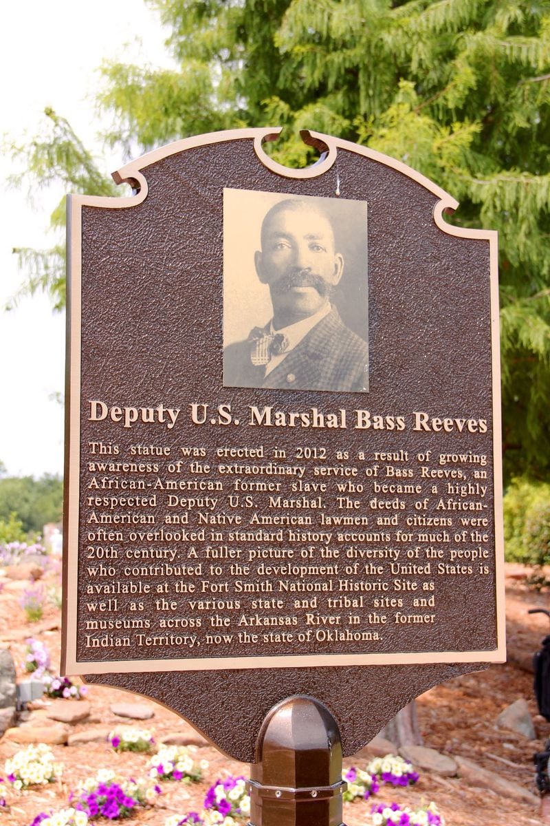 An equestrian statue honoring Deputy U.S. Marshal Bass Reeves stands in Fort Smith, Ark. A statement about the artwork on the Fort Smith website says that Reeves "brought in more outlaws from eastern Oklahoma and western Arkansas than anyone else. He was able to memorize the warrants for every suspect he was to arrest and bring to trial." (Courtesy of U.S. Marshals Service)