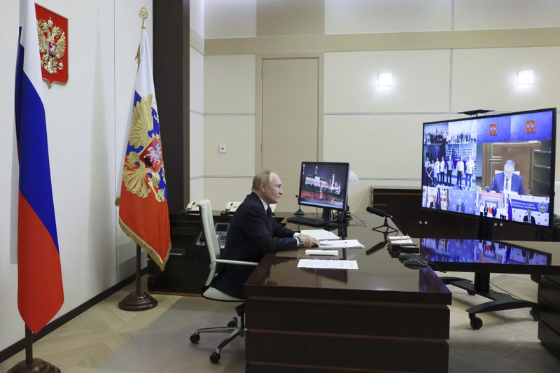 Russian President Vladimir Putin attends a ceremony to open social infrastructure facilities in Russia's new constituent entities via videoconference at the Novo-Ogaryovo state residence, outside Moscow, Russia, Monday, Sept. 30, 2024. (Mikhail Metzel, Sputnik, Kremlin Pool Photo via AP)