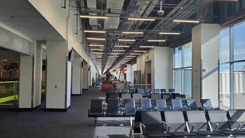 At Hartsfield-Jackson International Airport, workers on September 4, 2024 put the finishing touches on gate areas to complete the first phase of a project to widen Concourse D. Source: Hartsfield-Jackson