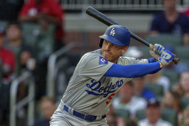 Los Angeles Dodgers' Freddie Freeman prepares to swing at the pitch in the first inning of a baseball game against the Atlanta Braves, Sunday, Sept. 15, 2024, in Atlanta. (AP Photo/Jason Allen)