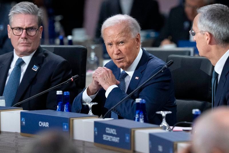 FILE - President Joe Biden, center, makes opening remarks during the NATO summit in Washington, July 10, 2024. It's been two weeks since Biden's debate with Donald Trump and there's rampant gloom in the party about Biden's chances in the fall if he stays in the race. On Thursday, July 11, the 11th lawmaker joined the list of Democrats calling on Biden to end his candidacy. After days of reckoning, many more are known to be harboring that wish. (AP Photo/Jacquelyn Martin)