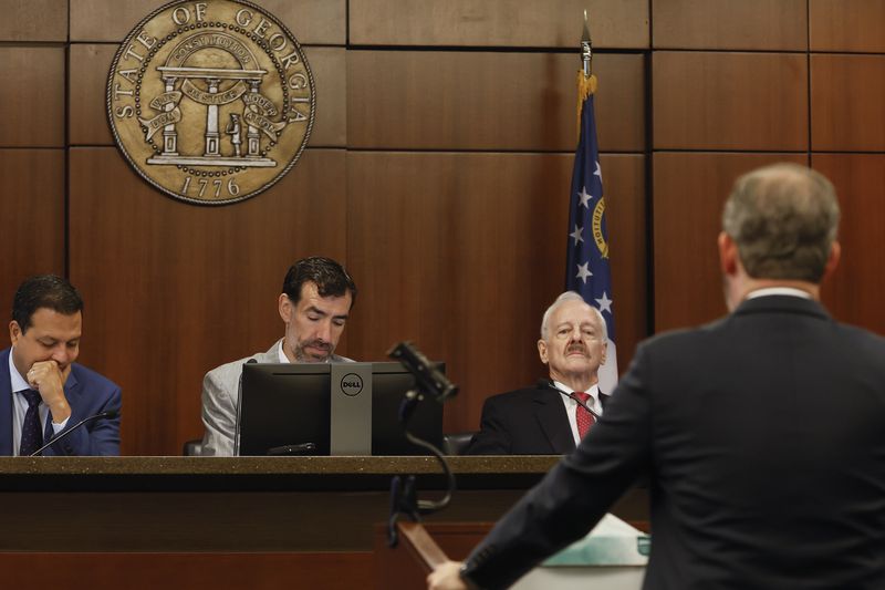 (Left to right) Judicial Qualifications Commission panel Dax Lopez, Judge Robert McBurney and Jack Winter listen to opening statements in the ethics hearing for suspended Georgia Court of Appeals Judge Christian Coomer’s. The three-member panel recommended Coomer be removed from the bench. (Natrice Miller/natrice.miller@ajc.com)  


