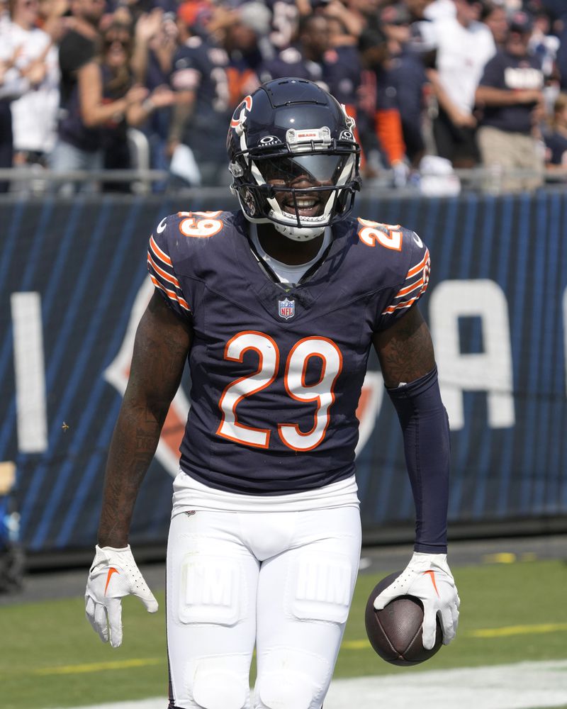 Chicago Bears cornerback Tyrique Stevenson smiles as he walks back to the bench after his touchdown off a pass attempt by Tennessee Titans quarterback Will Levis during the second half of an NFL football game Sunday, Sept. 8, 2024, in Chicago. (AP Photo/Nam Y. Huh)