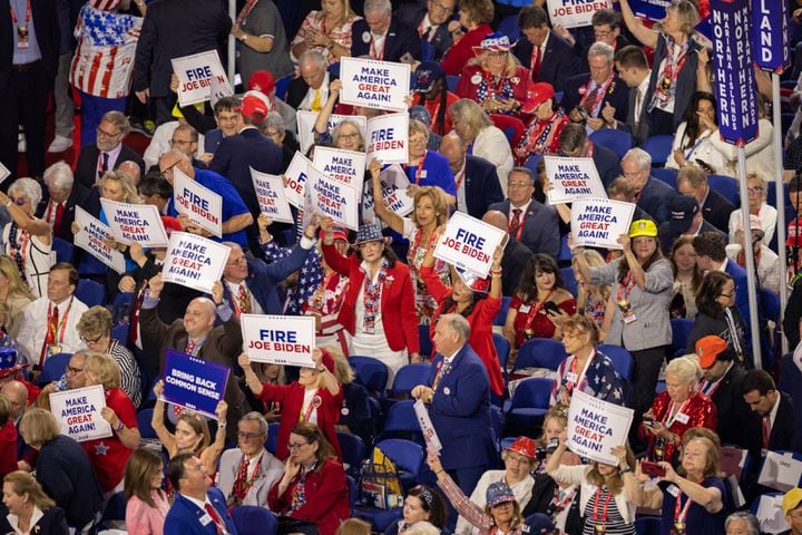 Delegates wave “Fire Joe Biden” signs at Fiserv Form in Milwaukee on Thursday, July 18, 2024, the fourth day of the Republican National Convention (Arvin Temkar / AJC)