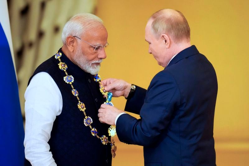 Russian President Vladimir Putin, right, awards Indian Prime Minister Narendra Modi with the Order of St. Andrew the Apostle the First-Called at the Kremlin in Moscow, Russia, Tuesday, July 9, 2024. (AP Photo/Alexander Zemlianichenko)