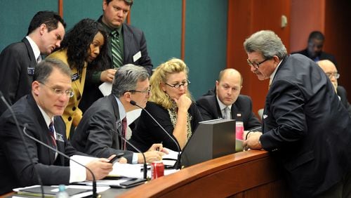 March 11, 2014 Atlanta: Rep. Alan Powell, right, co-sponsor of HB 875, the safe carry protection act, talks with Senate Judiciary Non-Civil Committee Chairman Sen. Jesse Stone Tuesday March 11, 2014. The meeting was a listening session where committee members heard from both sides of the gun bill. No vote was taken. BRANT SANDERLIN /BSANDERLIN@AJC.COM