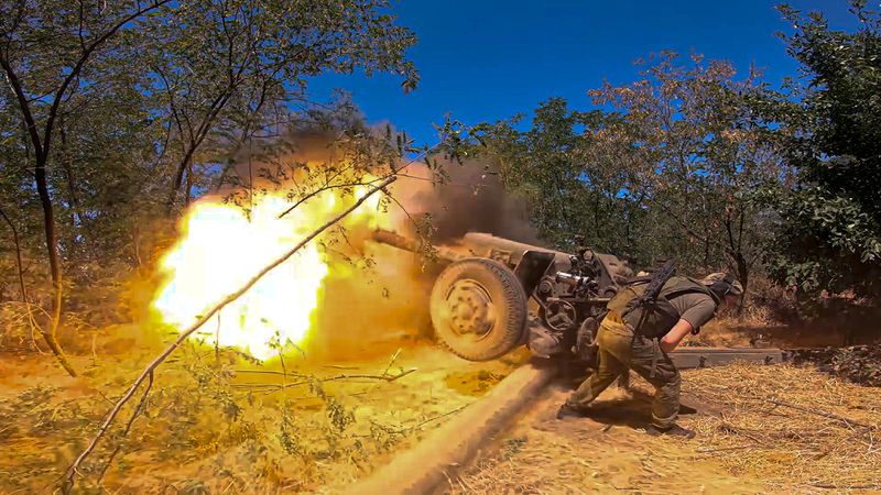 In this photo taken from a video released by the Russian Defense Ministry on Thursday, Aug. 22, 2024, a Russian soldier fires from D-30 howitzer towards Ukrainian positions in an undisclosed location in Ukraine. (Russian Defense Ministry Press Service via AP)