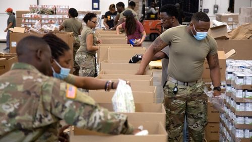 About 20 to 30 Georgia National Guard members are working at the food bank headquarters. STEVE SCHAEFER FOR THE ATLANTA JOURNAL-CONSTITUTION